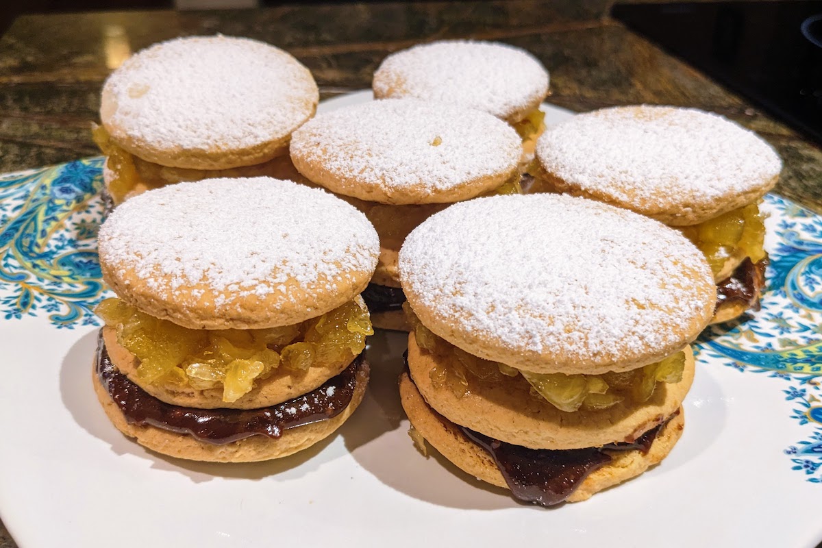 King Kong is a Peruvian dessert. The image shows layers of alfajor cookies filled with chunky caramel and dulce de leche.