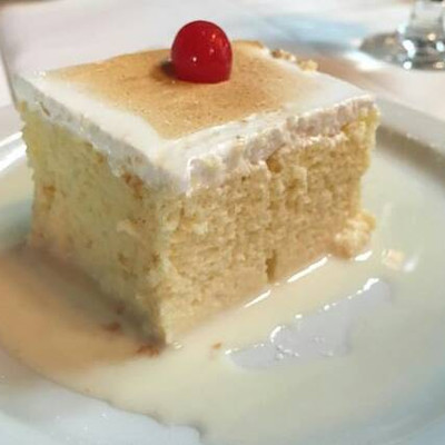 Tres leches in abundant milk juice, topped with a very appetizing meringue